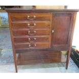 Edwardian mahogany music cabinet, five fall front drawers with brass handles and a panel door on
