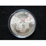 $1 USD 1986 fine silver eagle dollar in capsule (BUNC)