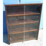 C20th oak four tier bookcase, with moulded top above sliding plate glass doors, W89cm D24cm H110cm