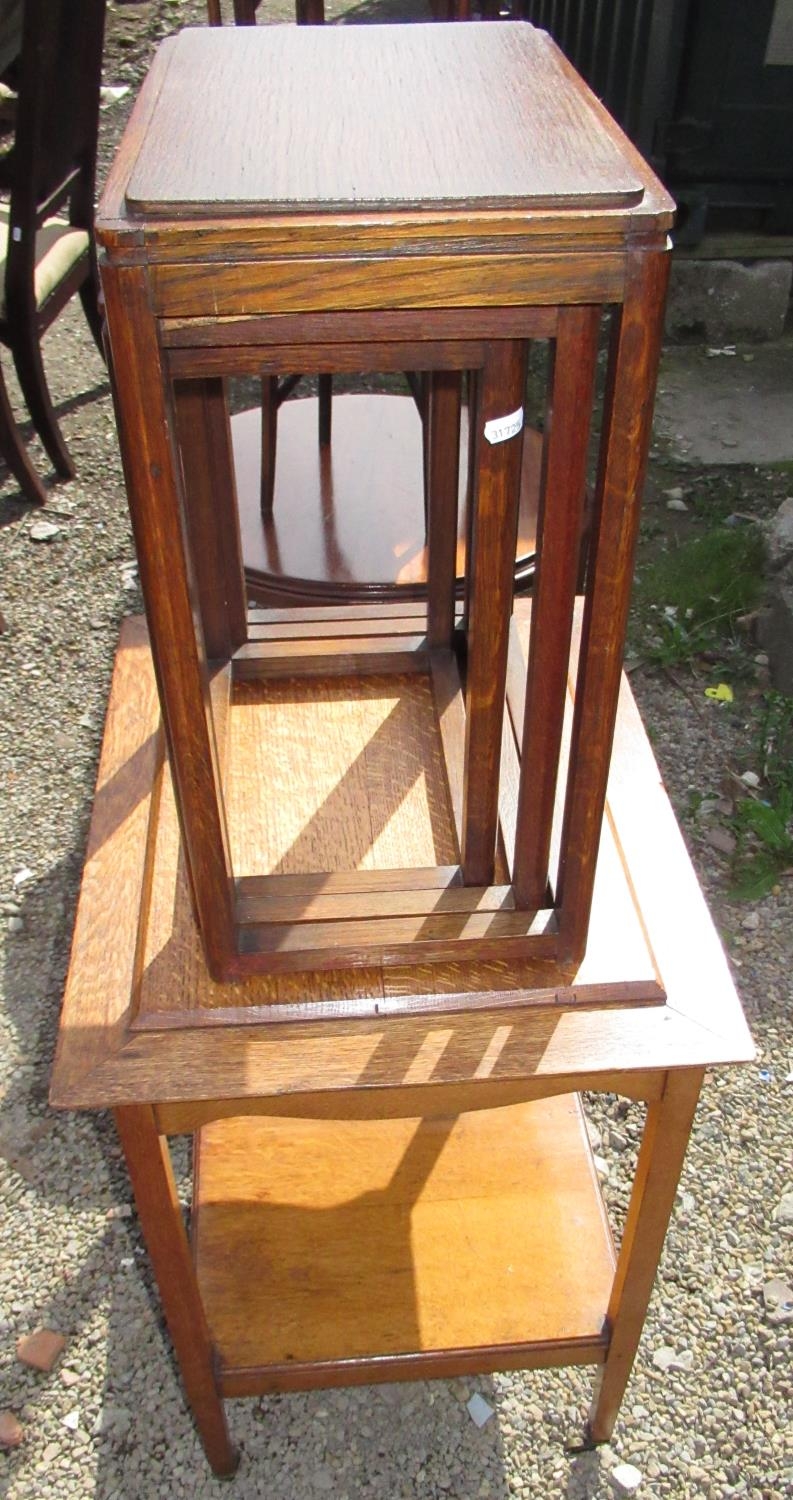 Nest of three oak Art deco coffee tables, rounded rectangular tops on shaped supports joined by - Image 2 of 2