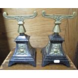 Pair of Victorian arts and crafts style cast iron and brass fire implement rests with curved top