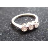 White metal three stone diamond ring, size O 1/2, 2.9g