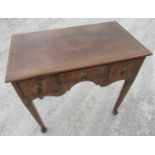 C18th style walnut and oak low boy, with herring banded top and three drawers with arched frieze