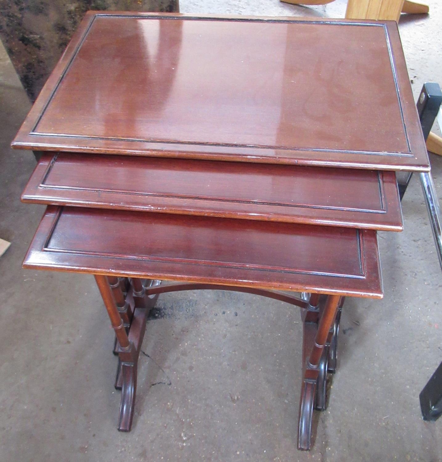 Nest of three Regency style mahogany tables by Archer & Smith Ltd. of Swindon, rectangular tops on