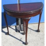 Geo. III style mahogany demi lune card table, folding top with floral carved border, pull out
