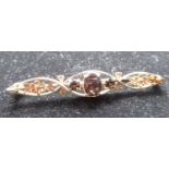 Hallmarked 9ct yellow gold bar brooch with three oval faceted smokey quartz stones inset in an