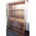 Hardwood bookcase, with five shelves and two drawers on plinth base, W115cm D40cm H194cm