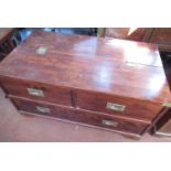 Campaign style mahogany side cabinet with half hinged top above one long and two short drawers on