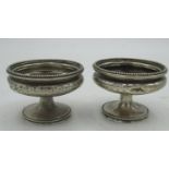 Geo.V hallmarked Sterling silver bright cut salts on circular pedestal bases (lacking liner) by