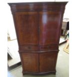 Geo. III style crossbanded mahogany serpentine front cocktail cabinet with dental cornice, two doors