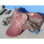 Leather pony saddle, pair of steel spurs, vintage heavy horse harness with brasses, two leather