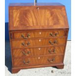 Geo. III style figured mahogany bureau, cross banded fall front revealing well fitted interior