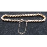 9ct yellow gold rope twist bracelet with safety chain and spring ring clasp stamped 9ct, L20cm, 4.8g