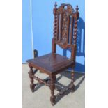 Chas. II style oak hall chair with pierced fruit carved splat and solid seat on turned and block