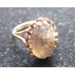 Hallmarked 9ct yellow gold Smokey quartz ring with an oval cut, claw set smoky quartz by L&S,