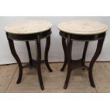 Pair of empire style occasional tables, with circular onyx top on gilt metal mounted scroll supports
