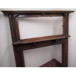 1930's oak fire surround with moulded cornice, octagonal mirror with twin barley twist supports, and