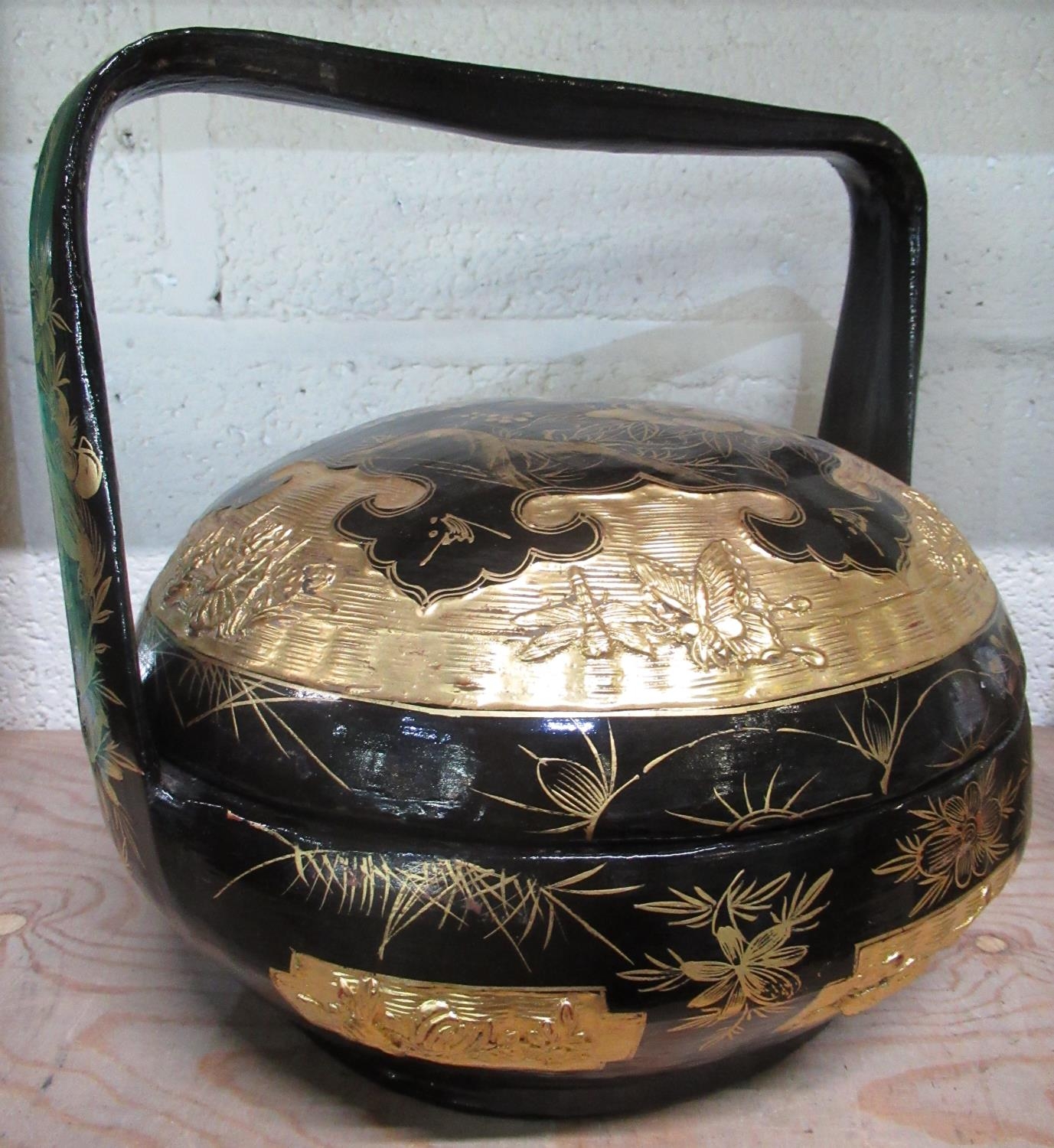 Chinese papier mache circular food basket and cover, chinoiserie decorated in gilt with exotic