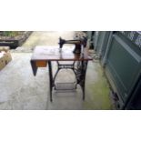 Singer treadle Sewing machine on iron base with pedal