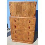 Art Deco figured walnut tallboy with two doors and four long graduated drawers with red composite