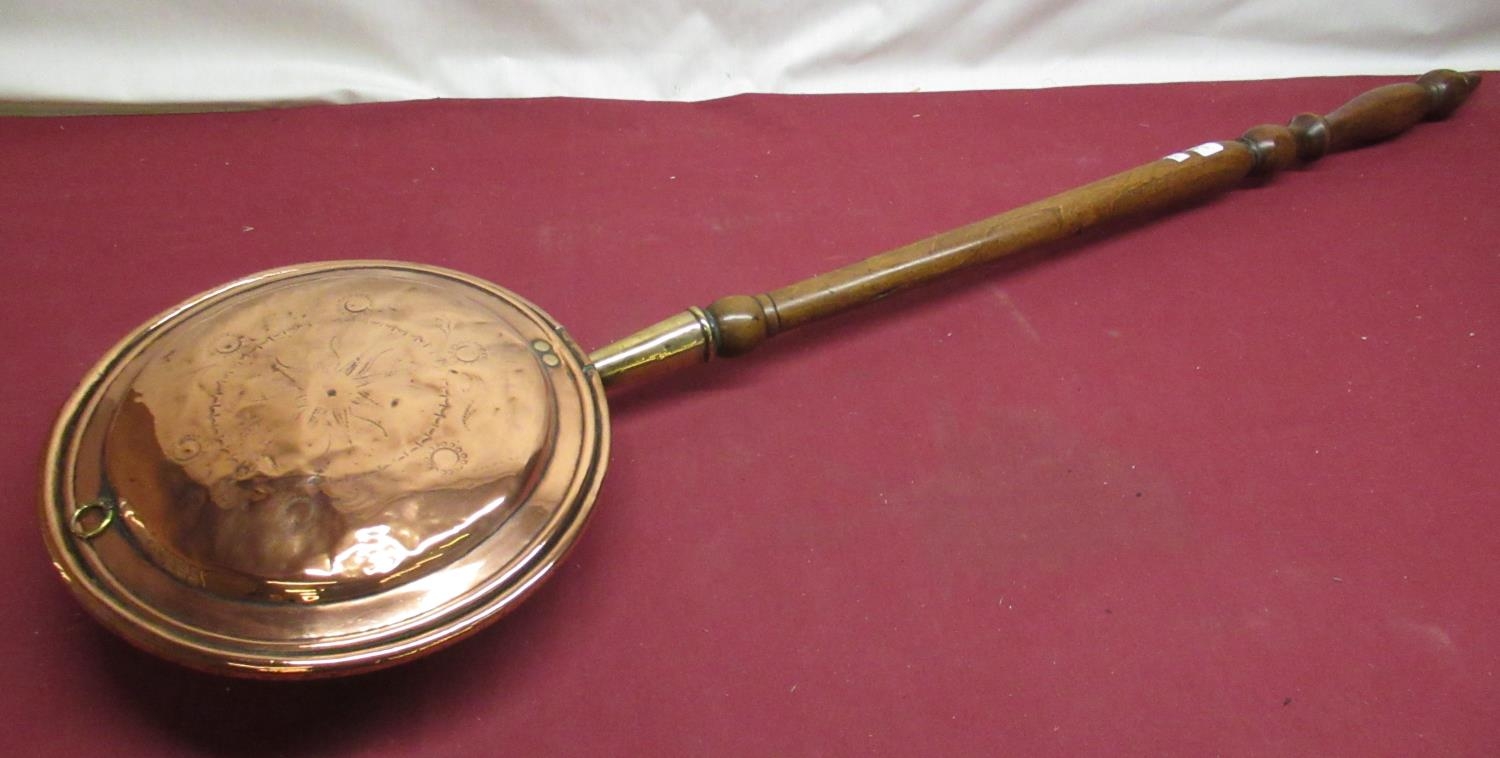 Late Victorian copper warming pan with turned fruitwood handle, with engraved decoration to the lid,