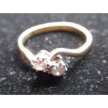 18ct yellow gold diamond ring with two round cut, claw set diamonds, stamped 18ct & Plat, size P 1/