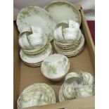 Continental porcelain tea service, printed with green leafage and berries on white ground, 35 pcs