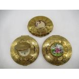 KIGU gilt circular engine turned compacts, one with cameo cover, one with hinged portrait cover