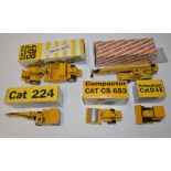 Five diecast models of construction machinery by NZG Modelle of West Germany, caterpillar