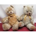 Mid C20th straw filled teddy bear in golden mohair with jointed arms and legs and glass eyes, and