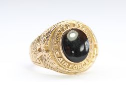 Mid C20th US Airforce 10 carat gold fraternity type signet ring with central black onyx stone,