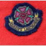 A mid C20th Captains QLR (Queens Lancashire Regt.) Officers mess dress with lapel insignia and
