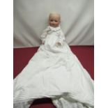 Armand Marseille Koppelsdorf 1330 A 12 M bisque headed doll wearing a christening gown with lace