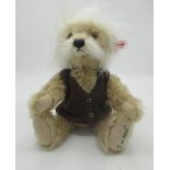 Steiff Einstein bear in blonde mohair wearing a brown vest with embrodered paw, limited edition of