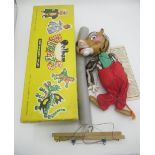 Pelham Puppets Tiger 1963 with painted face, hand and feet and fur upper body, wearing red