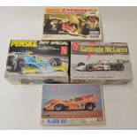 4 plastic model kits: AMT Penske Indy Special. Kit started, Johnny Rutherford Gatorade McLaren