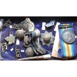 Collection of British Militaria including British Military Cap Badges, buttons, inert ammunition,