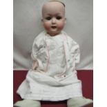 Heubach Koppelsdorf bisque headed doll model 267. 6 1/2 wearing embroidered felt jacket, white