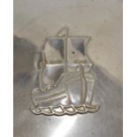 Three hub caps, a vintage early 1950's Plymouth wheel hub cap with Mayflower sailing ship emblem,