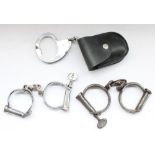 Three pairs of Hiatt police handcuffs of different ages