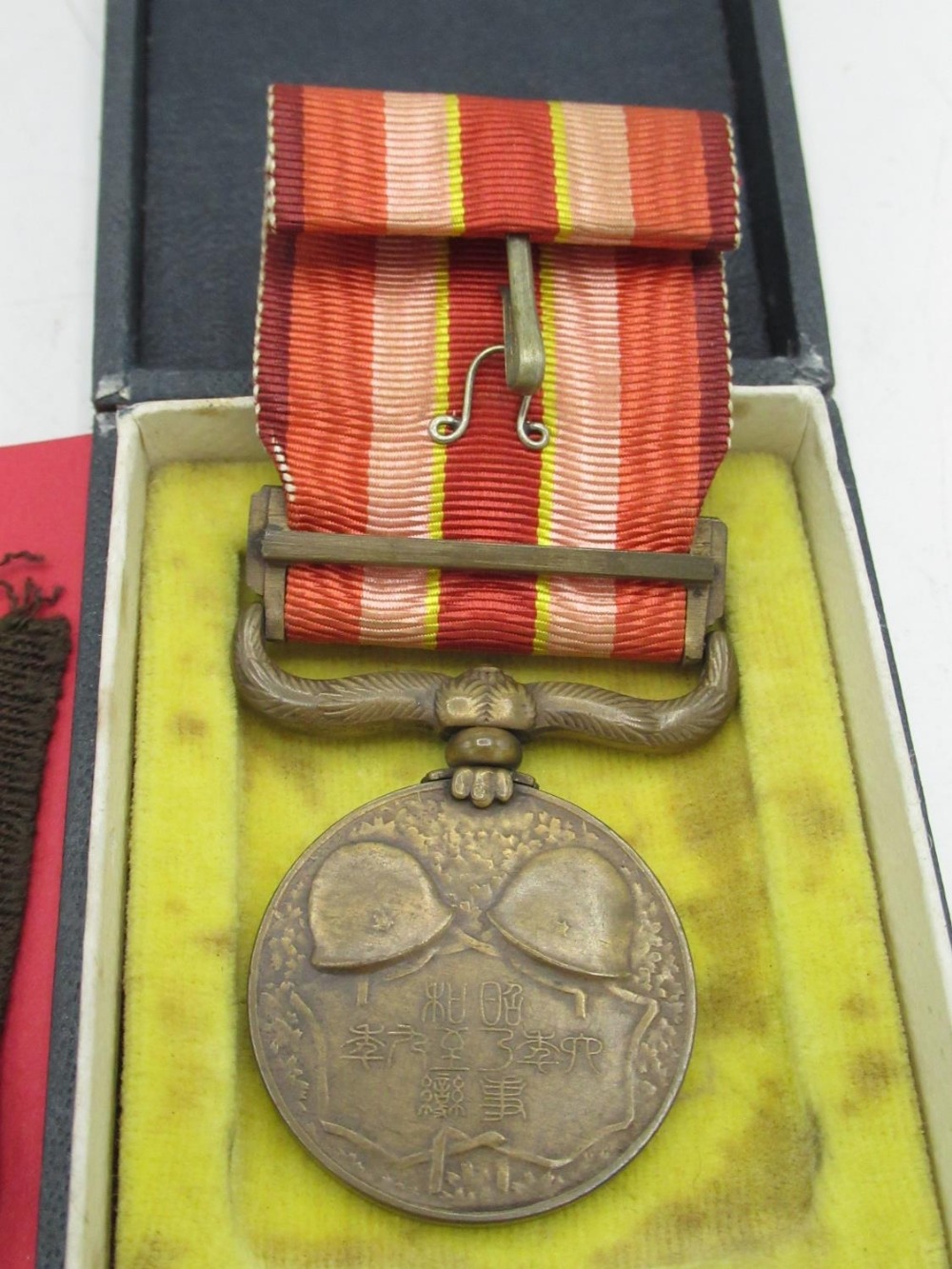 Two cased Japanese WWII period service medals, pair of Japanese cloth collar dogs (3) - Image 3 of 4