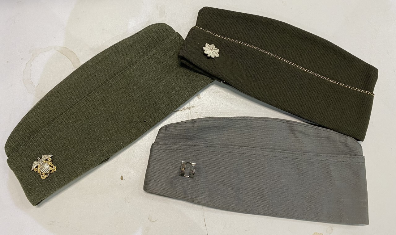 Three garrison caps with metal insignia