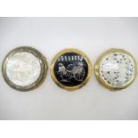 Circular Compact with Pagoda and mountain scene carved into mother of Pearl to front, another