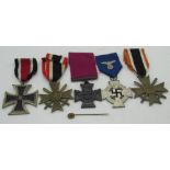 Two German 1939 Merit Cross medals, infantry combat lapel pin, German faithful service medal (