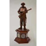 Danbury Mint "The Defender", painted resin sculpture on wooden plinth, with five period coins