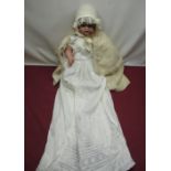 CM Bergmann bisque headed doll stamped 13 to the neck, with curly auburn wig, lined cape, lace