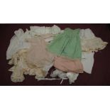 Collection of Edwardian and later Doll and baby clothing in various colours and materials