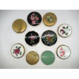 Six Stratton compacts all with floral covers, a Vanity Fair compact with gilt cover, and three other