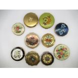 Four Stratton compacts all with floral covers, three similar Kigu compacts, a Regent of London