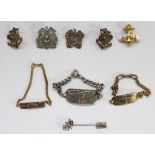 Selection of US military WW2 era sterling silver insignia including three sweetheart bracelets (US